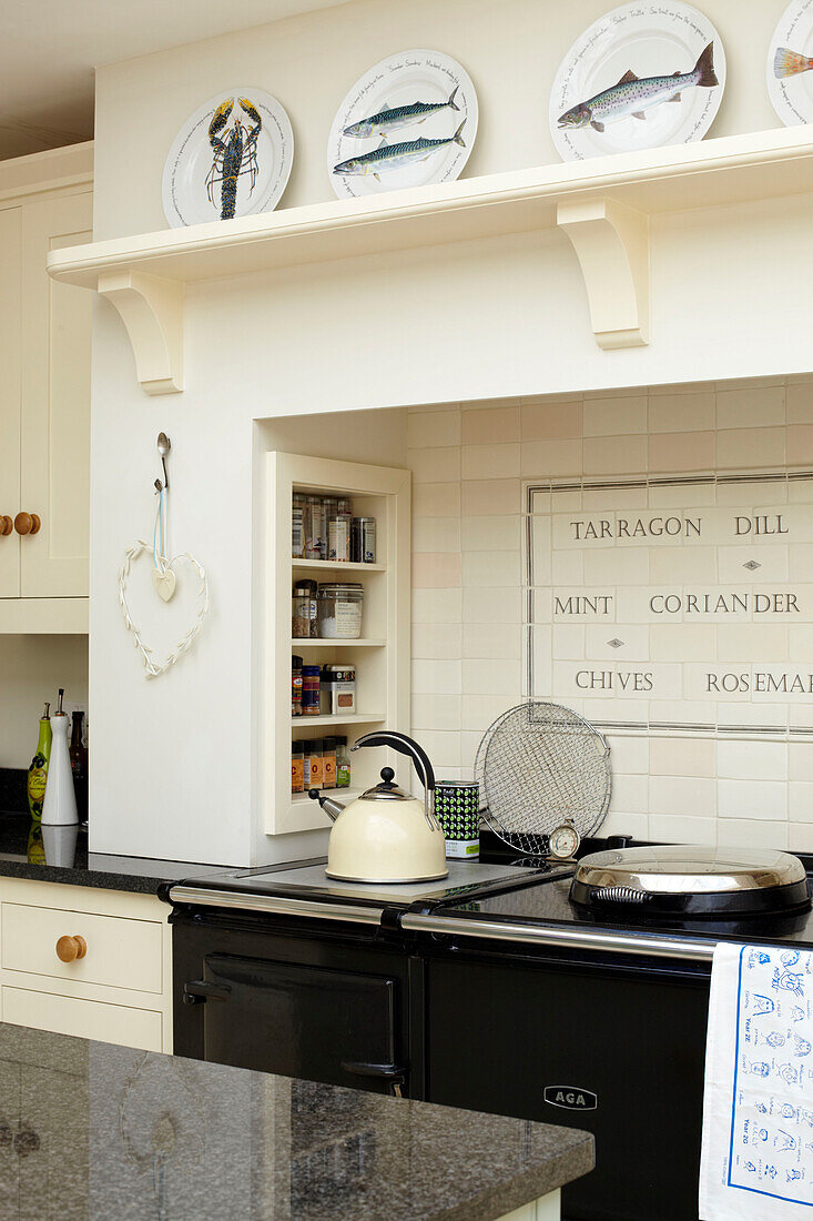 Recessed Aga in cream farmhouse kitchen, Bembridge, Isle of Wight, England, UK