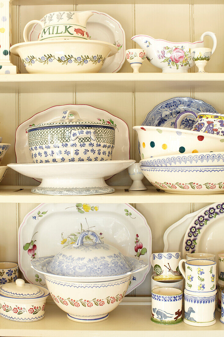 Assorted crockery on kitchen dresser in Wiltshire home, England, UK