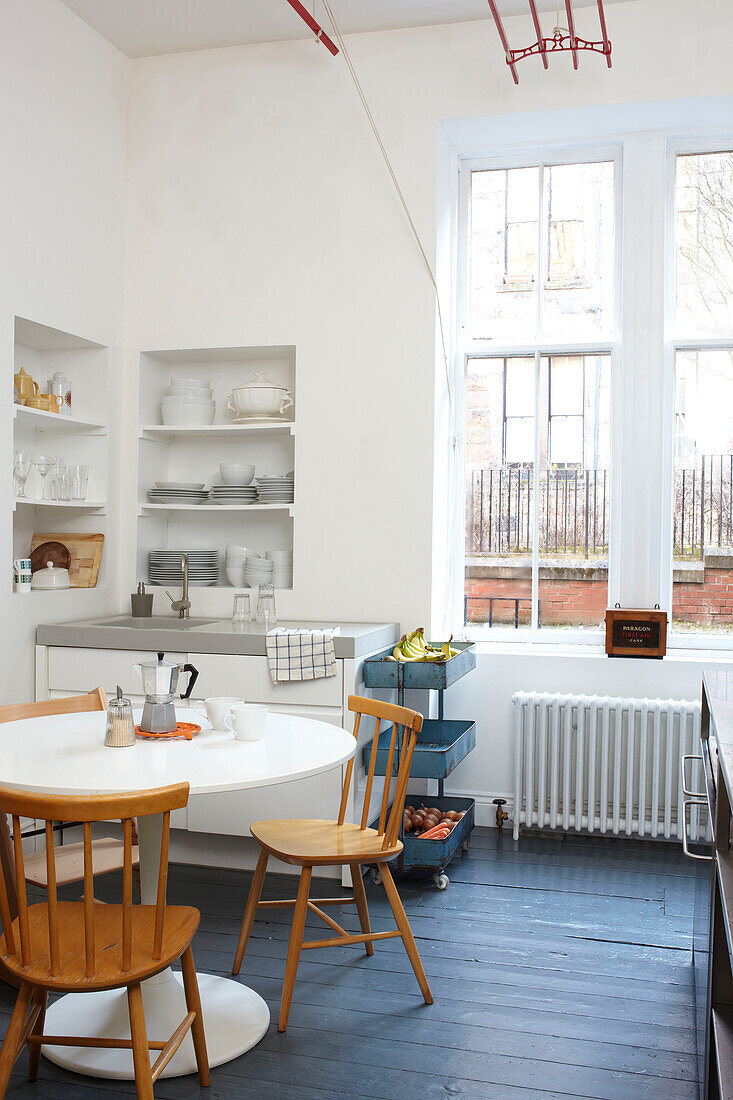 Tulip table in uncurtained kitchen of Scottish home UK