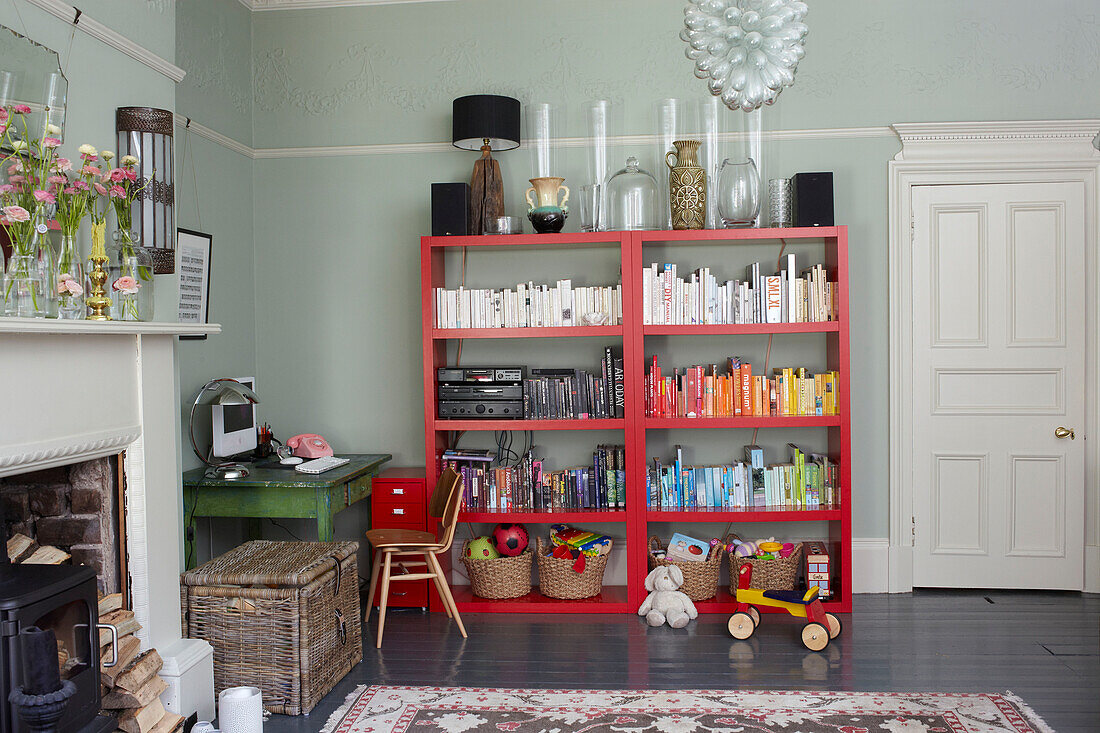 Vases and books on storage unit in living room of Scottish apartment building UK