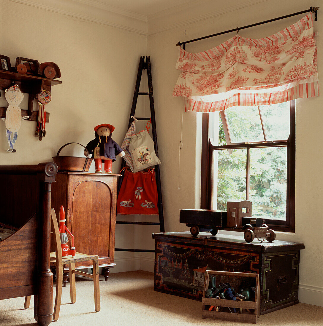 Corner of child's bedroom with ladder and toy chest