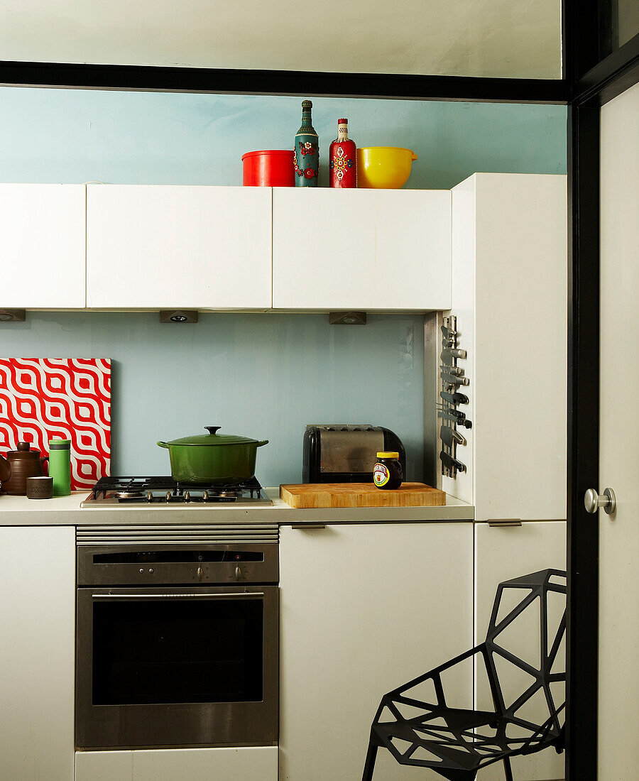 60s styled kitchen with modern chair