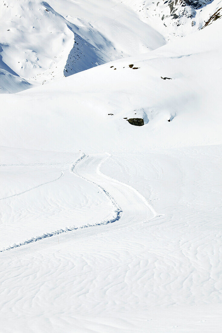 Ski-tracks in snow on mountainside in Zermatt, Valais, Switzerland