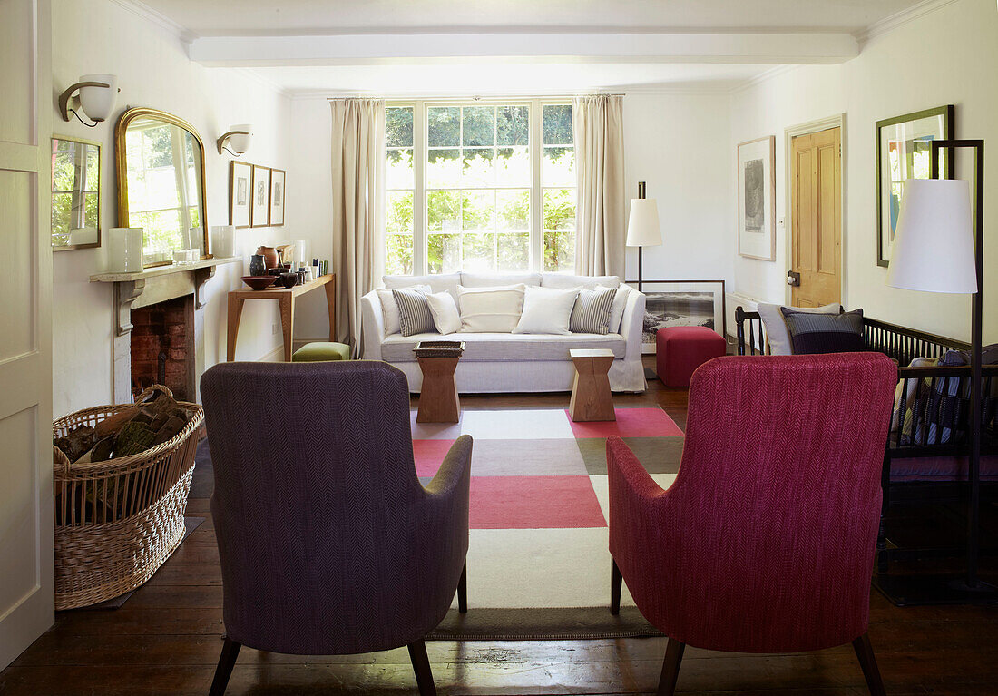 Living room with checkered rug and upholstered chairs