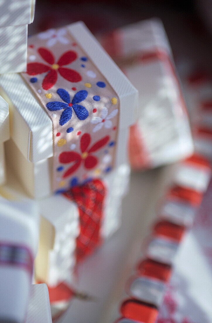 Close up of Christmas gift boxes tied with ribbons