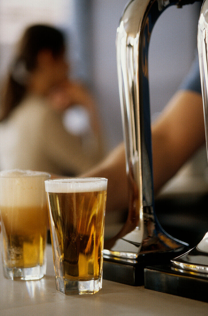 Bar with beer pumps and glasses of beer