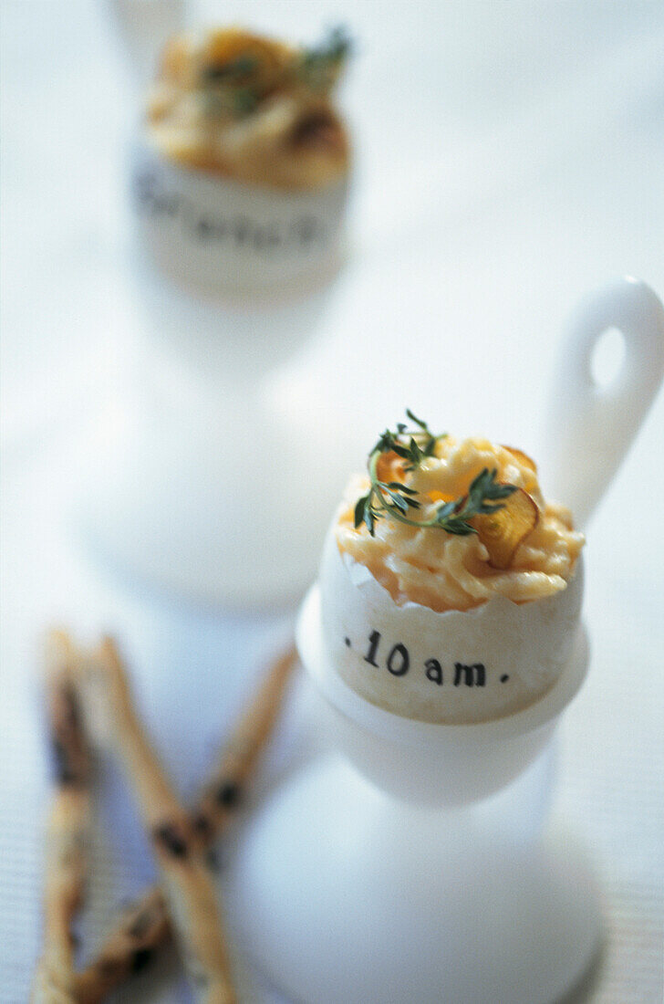 Scrambled eggs garnished with garlic and thyme