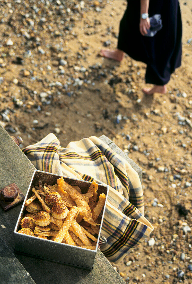 Picnic box of curry puffs and parmesan toasts