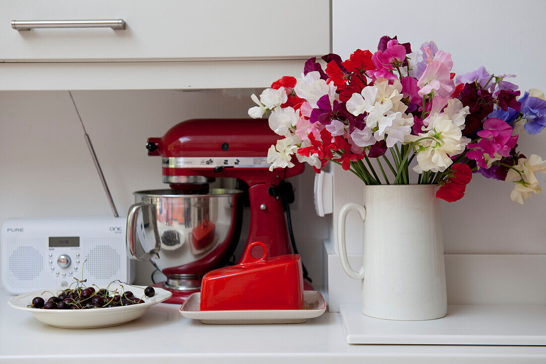 Food mixer and sweet peas in contemporary Lewes home,  East Sussex,  England,  UK
