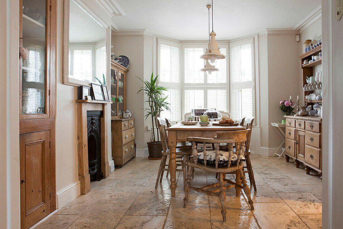 Wooden table and chairs in dining room of Brighton home, East Sussex, England, UK