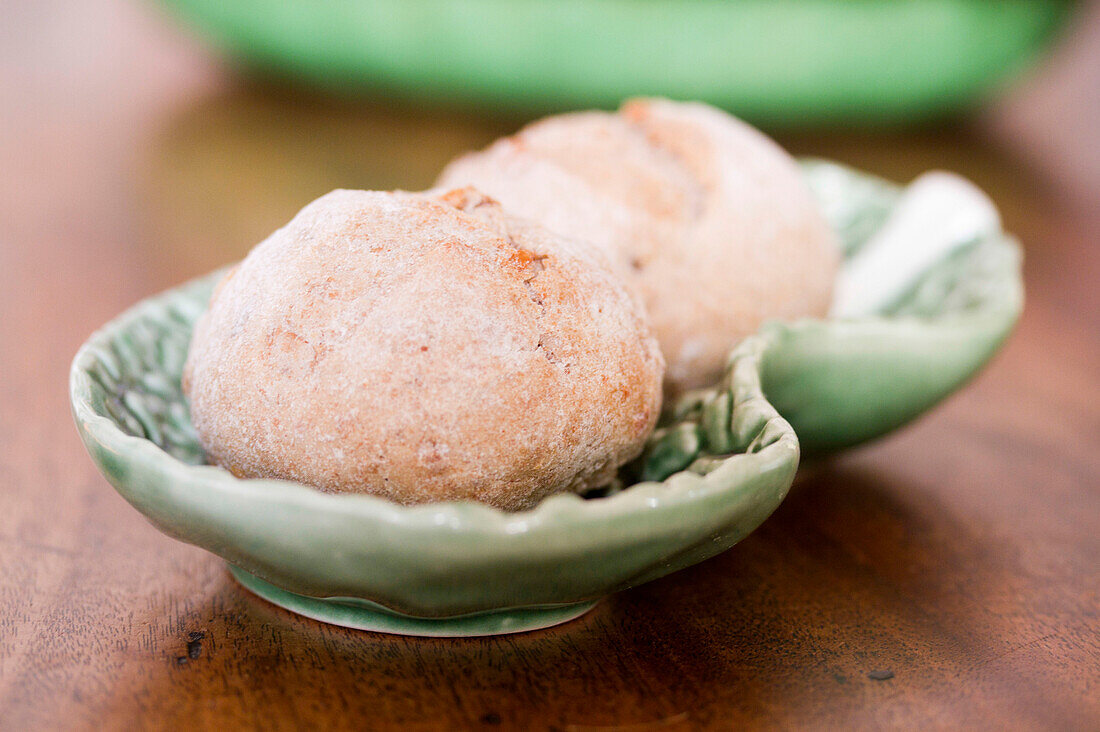 Breadbuns on light green serving dish in Castro Marim Portugal