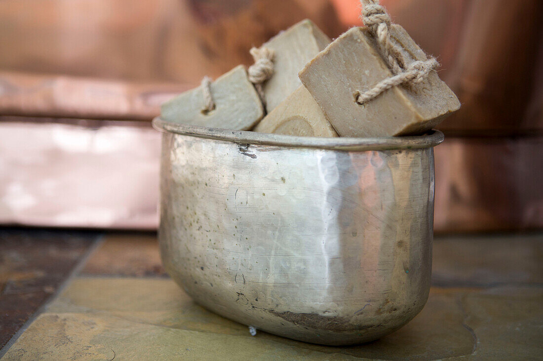 Artisan soaps in vintage hand-beaten bowl Edwardian West Sussex townhouse England UK