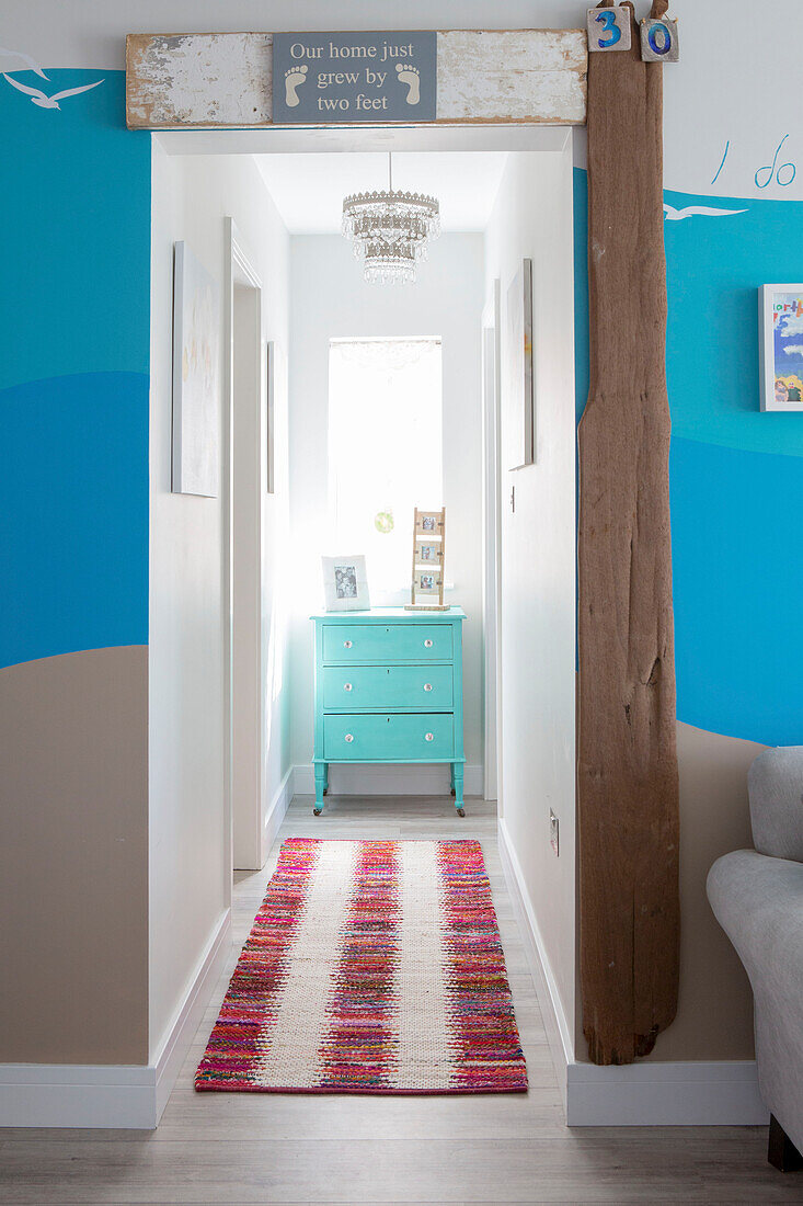 Driftwood at doorway to hall extension in 1950s coastal beach house West Sussex UK