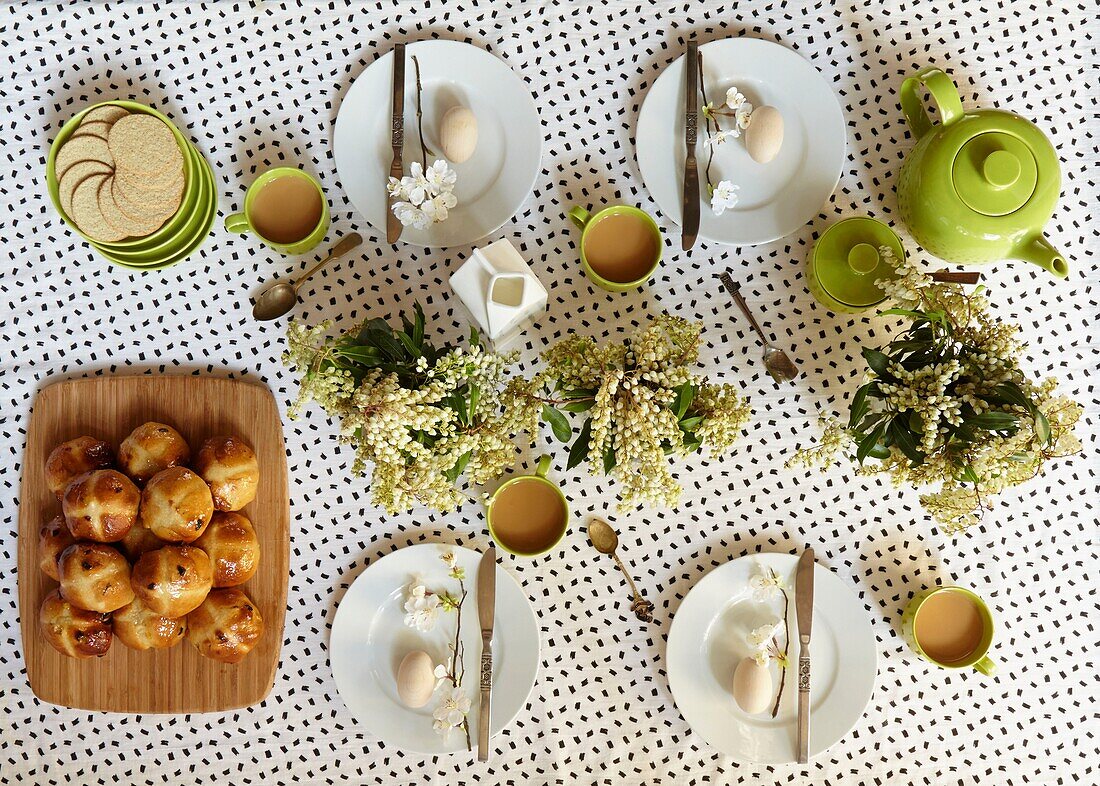 Hot cross buns and boiled eggs on breakfast table in London home   England   UK