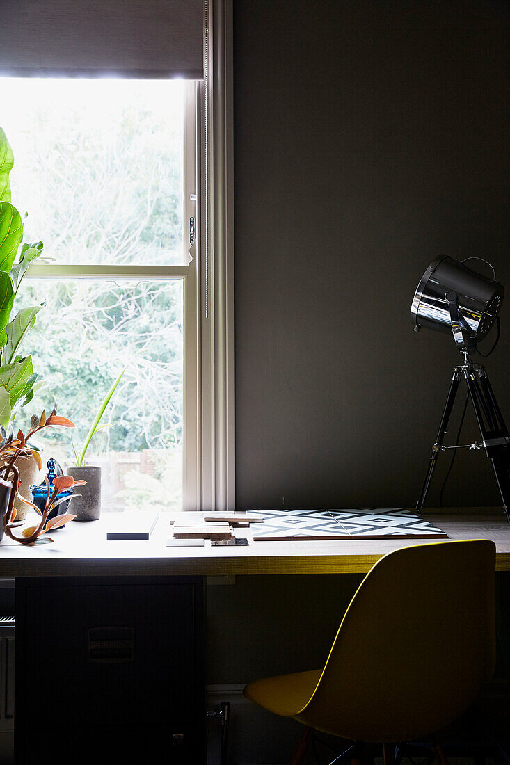 Desk and chair at sash window in East London townhouse  England  UK