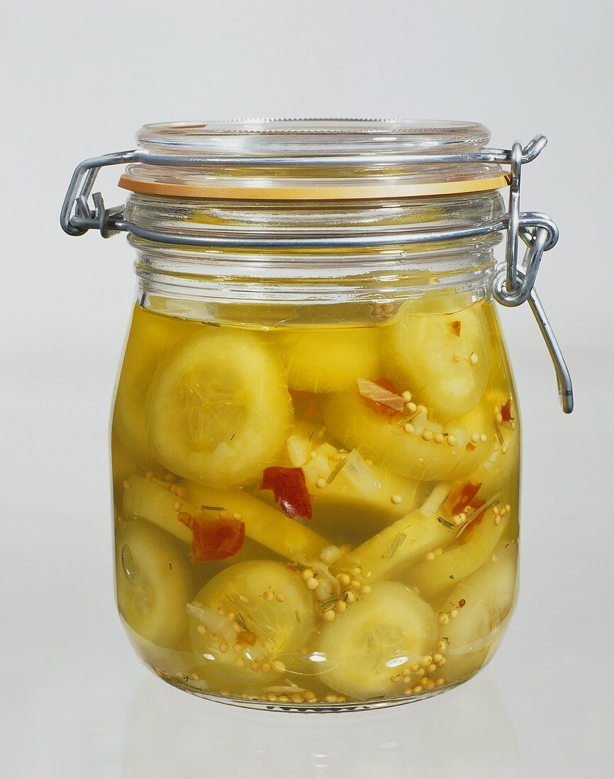 Mustard-pickled gherkins in pickling jar