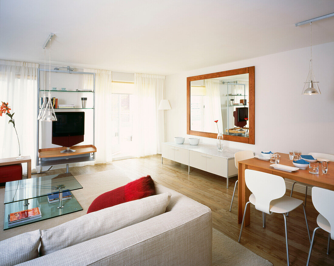 Modern open plan living and dining area in neutral tones