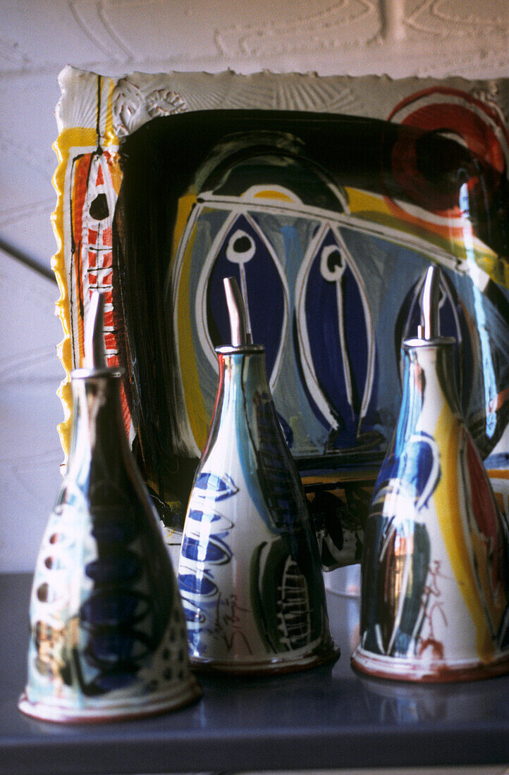 Still life of pottery jugs and serving dish