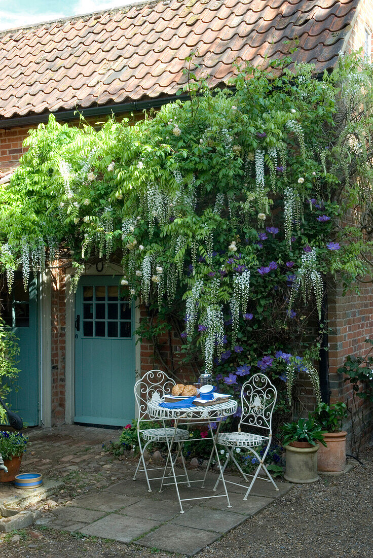 Brick house garden exterior set for breakfast