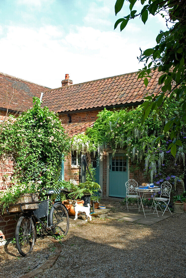 Brick house exterior gravelled patio and bicycle