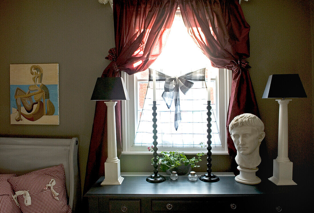 Tall lamp bases with small black shades in Regency style with curtains in unlined silk taffeta 