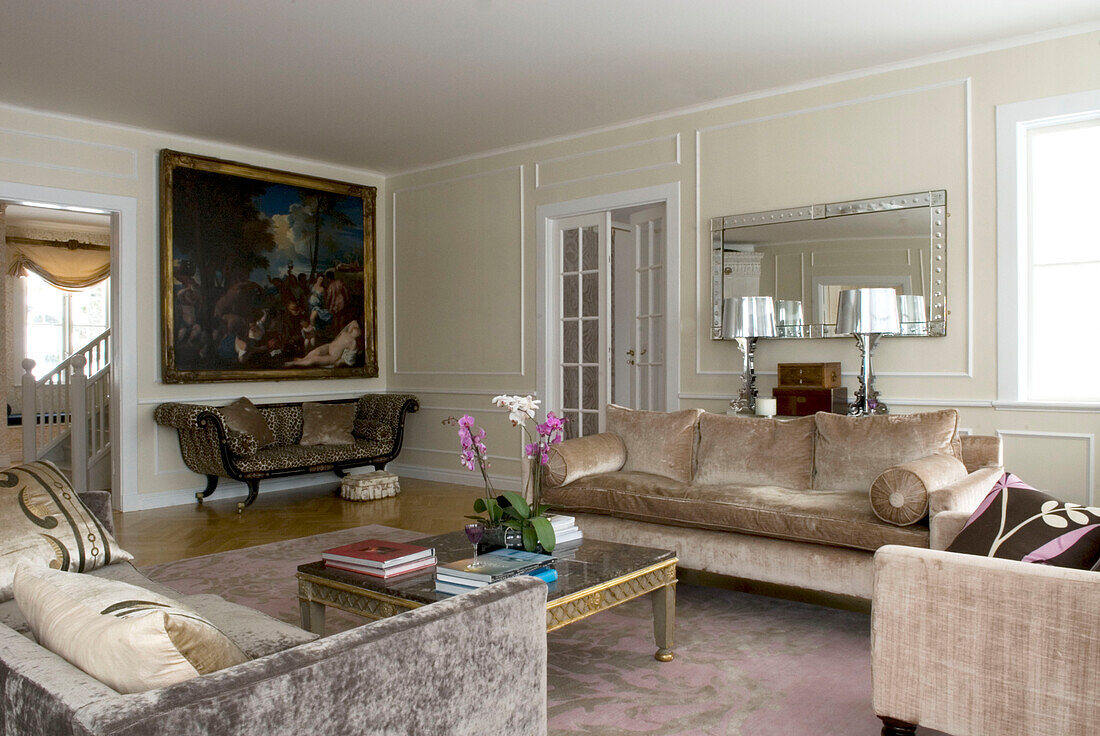 Eclectic living room with sofa and orchid on the table