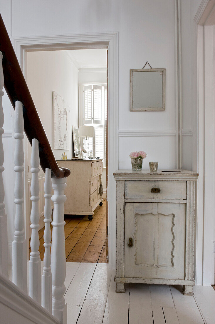 Cupboard and staircase in hallway