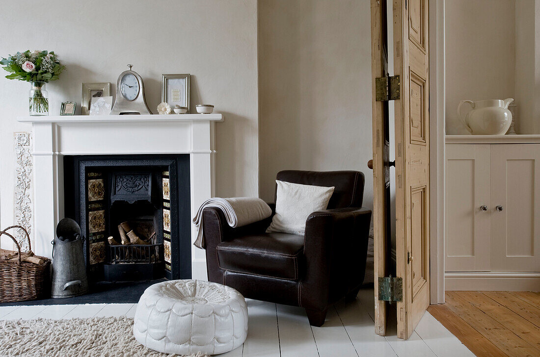 Armchair by fireplace in living room