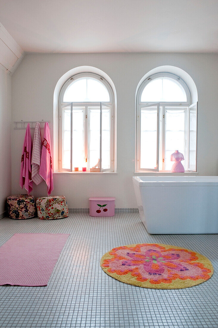 Arched windows in tiled Odense bathroom