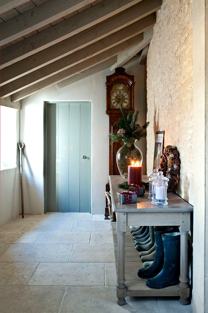 Wellington boots on hallway table with grandfather clock Wiltshire