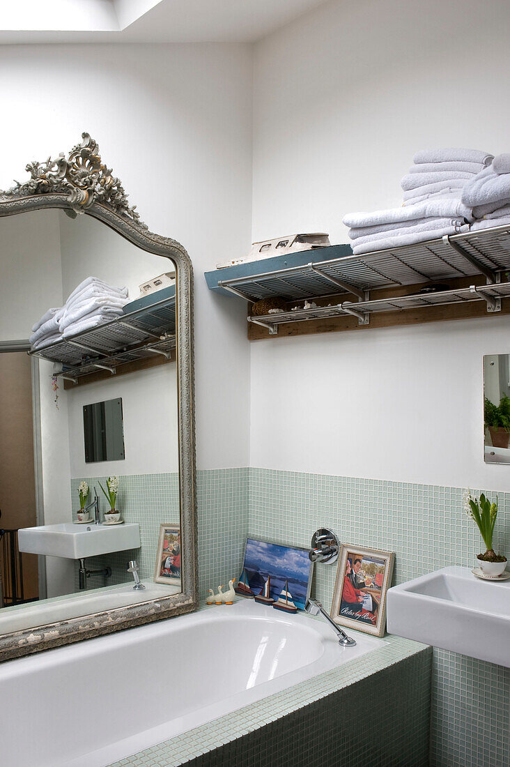 Bathroom with large decorative mirror