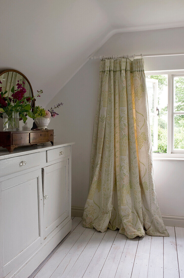 Bathroom with window and curtains