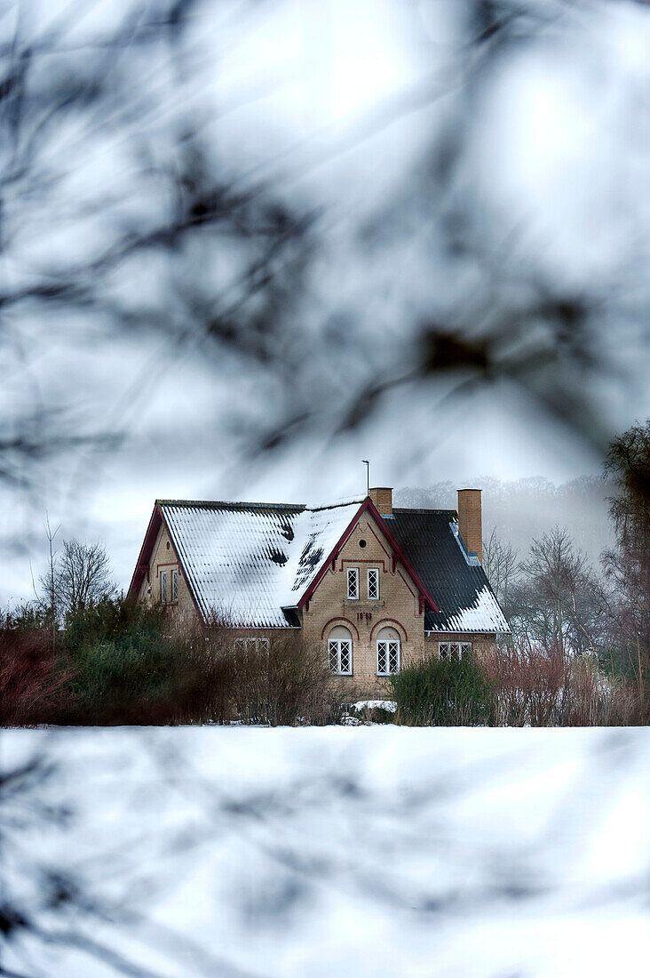Country house set in winter landscape Odense Denmark