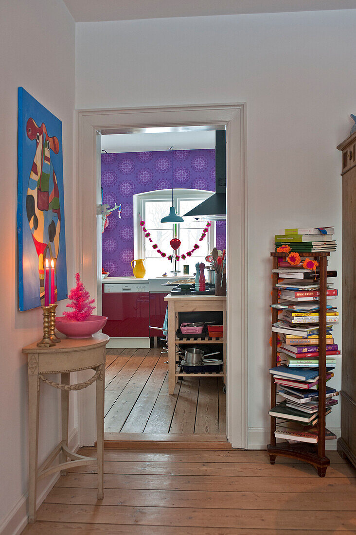 Book storage in hallway to kitchen in modern Odense family home Denmark