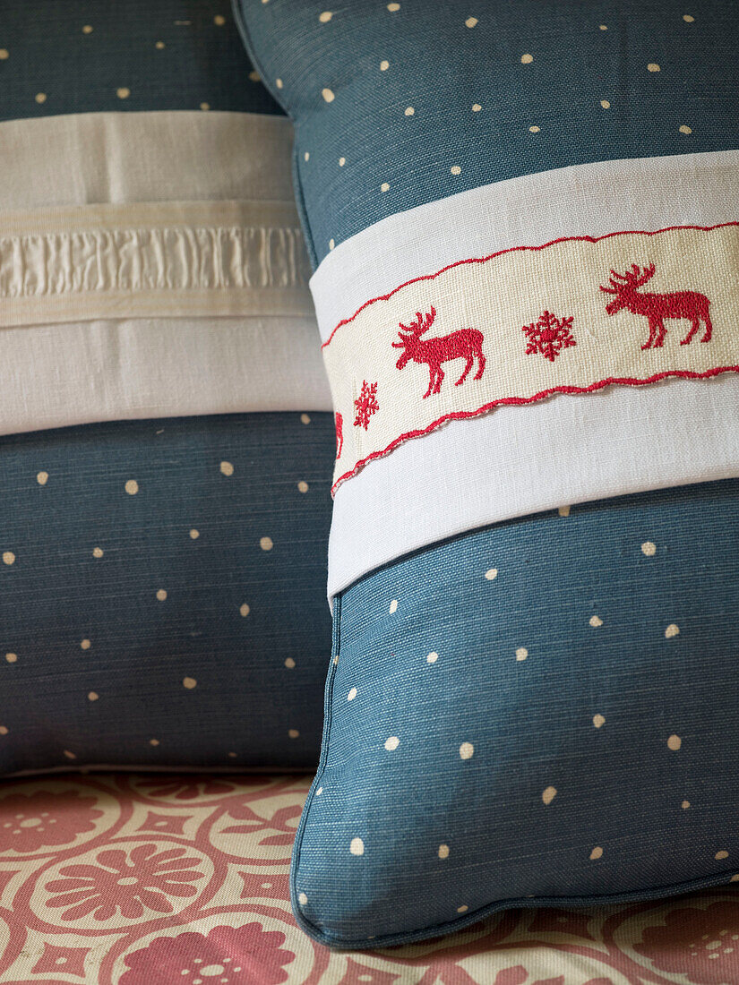 Two spotted cushions with Christmas detail