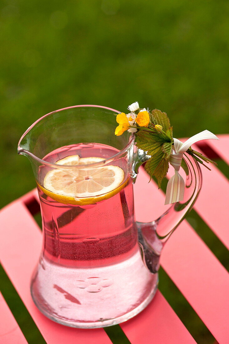 Jug of pink lemonade on table in Brecon, Powys, Wales, UK
