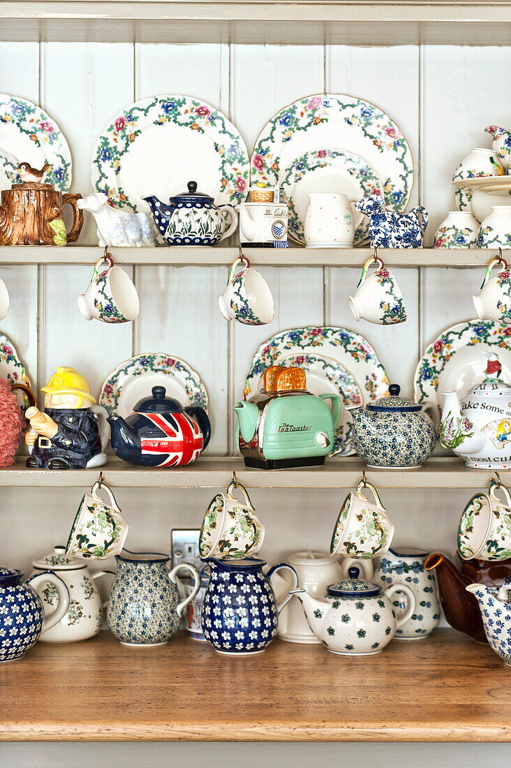 Wall mounted china cabinet in rural Blagdon home, Somerset, England, UK