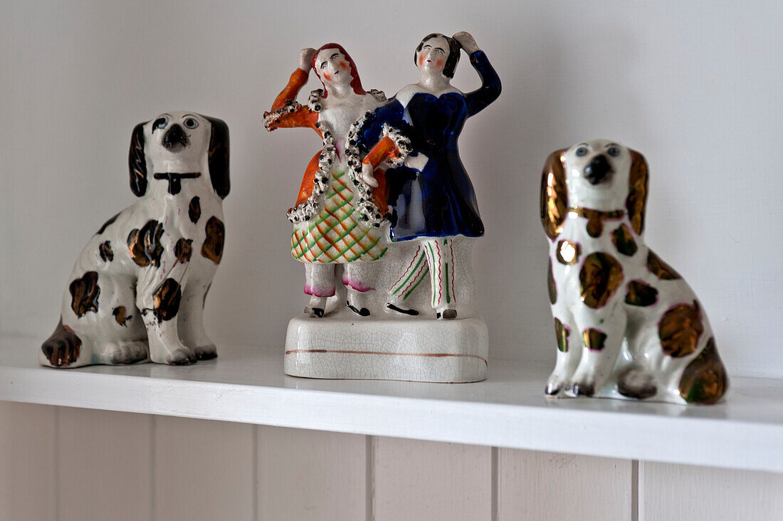 Figurine ornaments on shelf in beach house Cornwall England UK