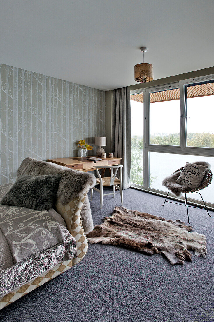 Chair at window in Lechlade bedroom Gloucestershire England UK