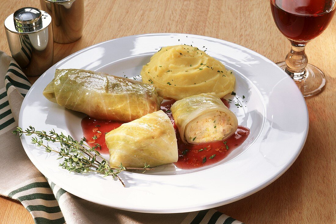 Cabbage roulade with mashed potato and red sauce