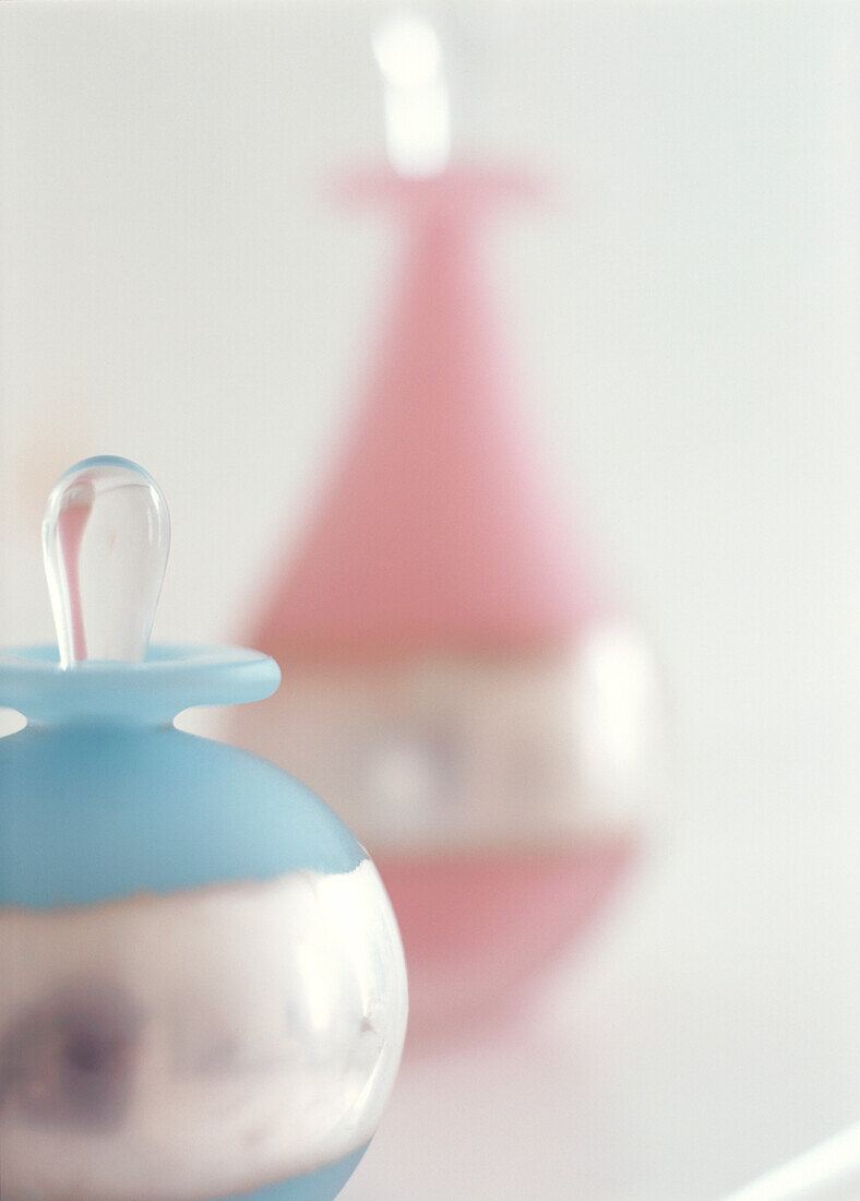 Pink and blue frosted glass bottles