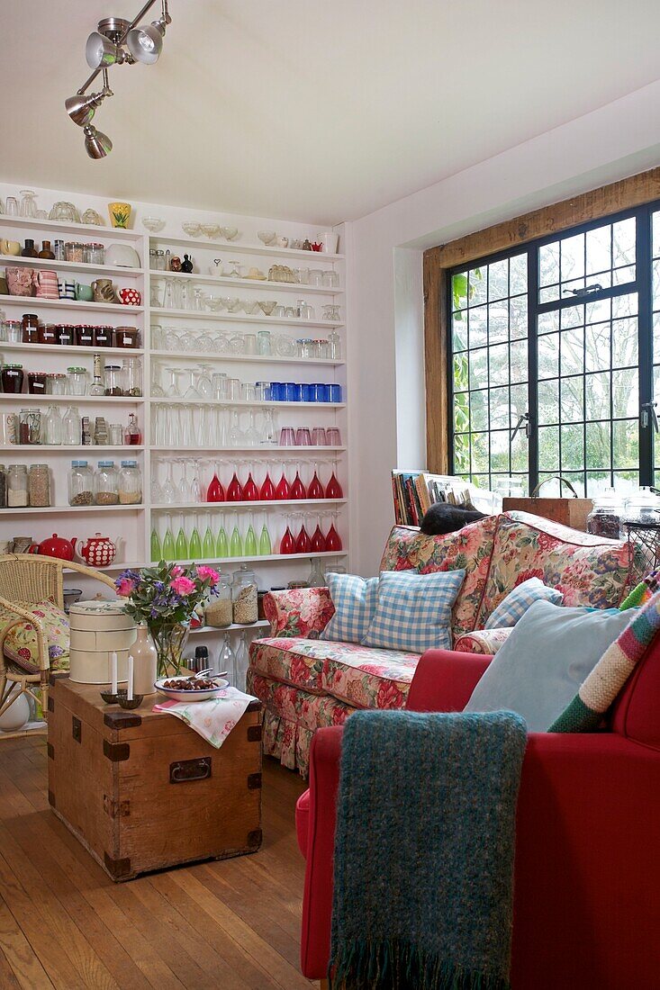 Extensive collection of storage jars on shelving display in Cranbrook family home, Kent, England, UK