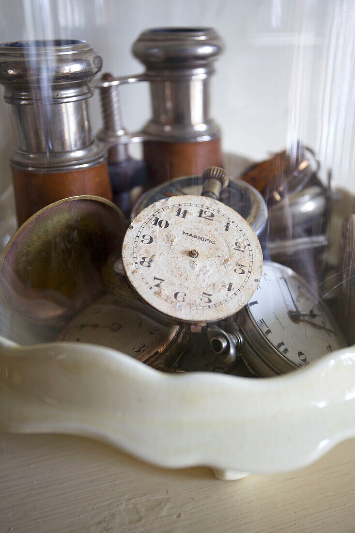 Vintage binoculars and clock face in Victorian villa Kent England UK