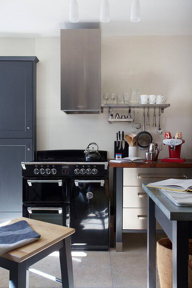 Kettle on hob of black range oven in Old Town kitchen Portsmouth England UK