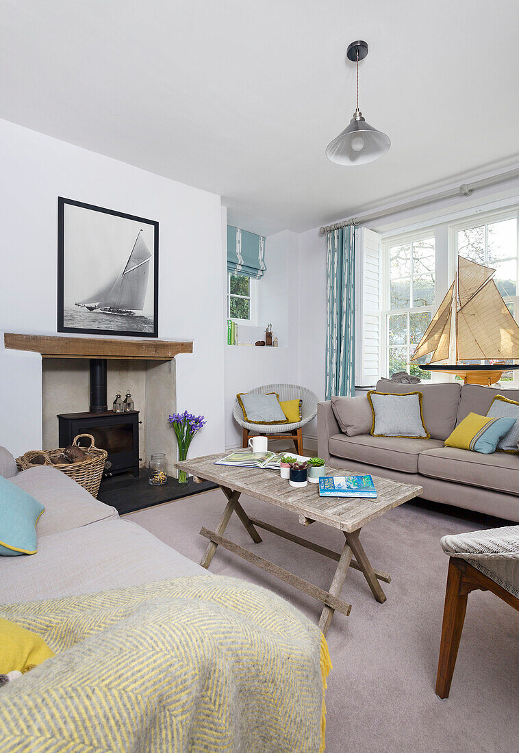 Model boat in window of Dartmouth living room with folding table Devon UK