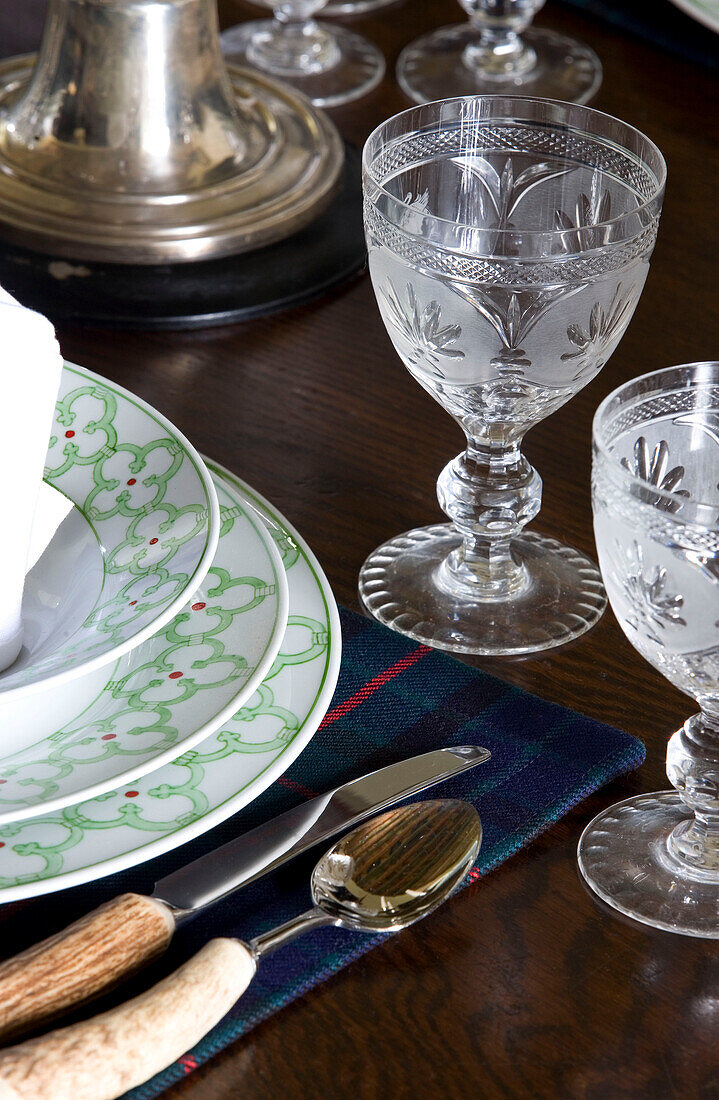 Wine glasses at place setting on Scottish table UK