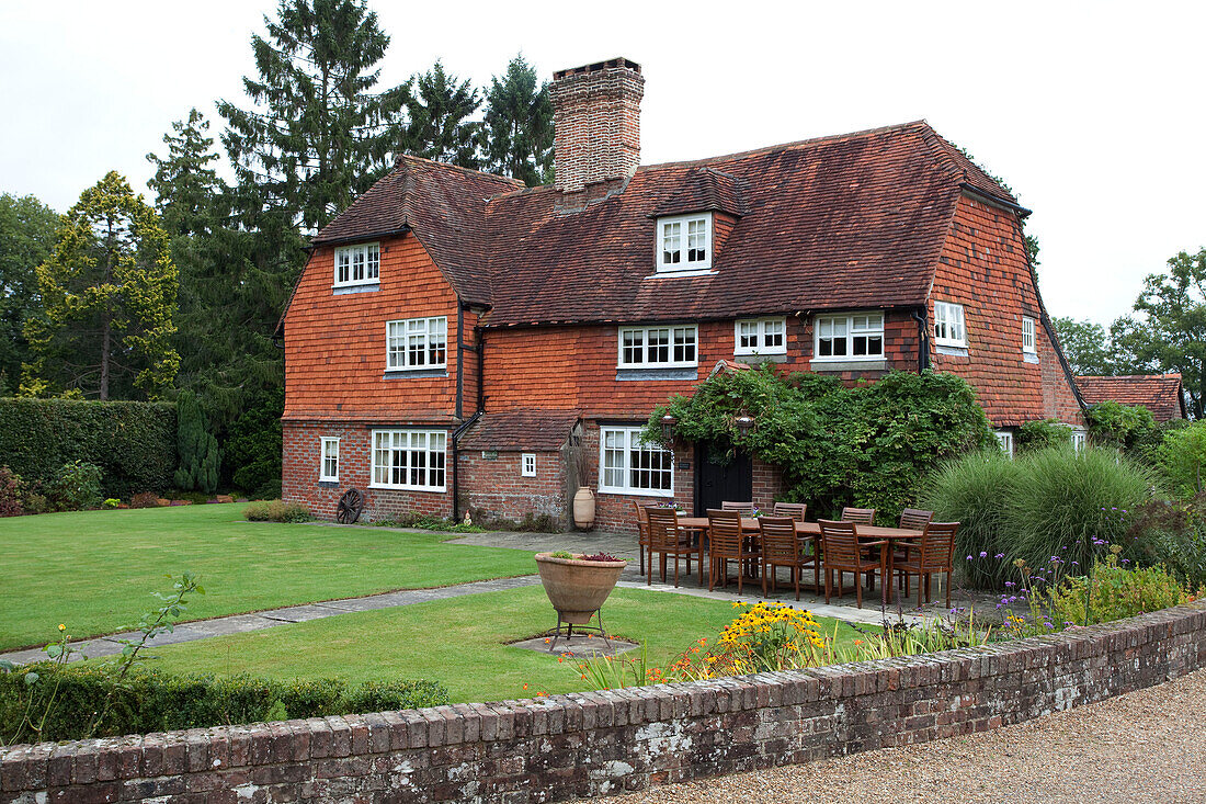 Lawned garden exterior of Sussex country home UK