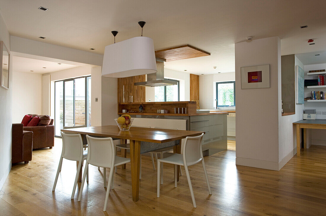 Table for six in open plan living area of London home, England, UK