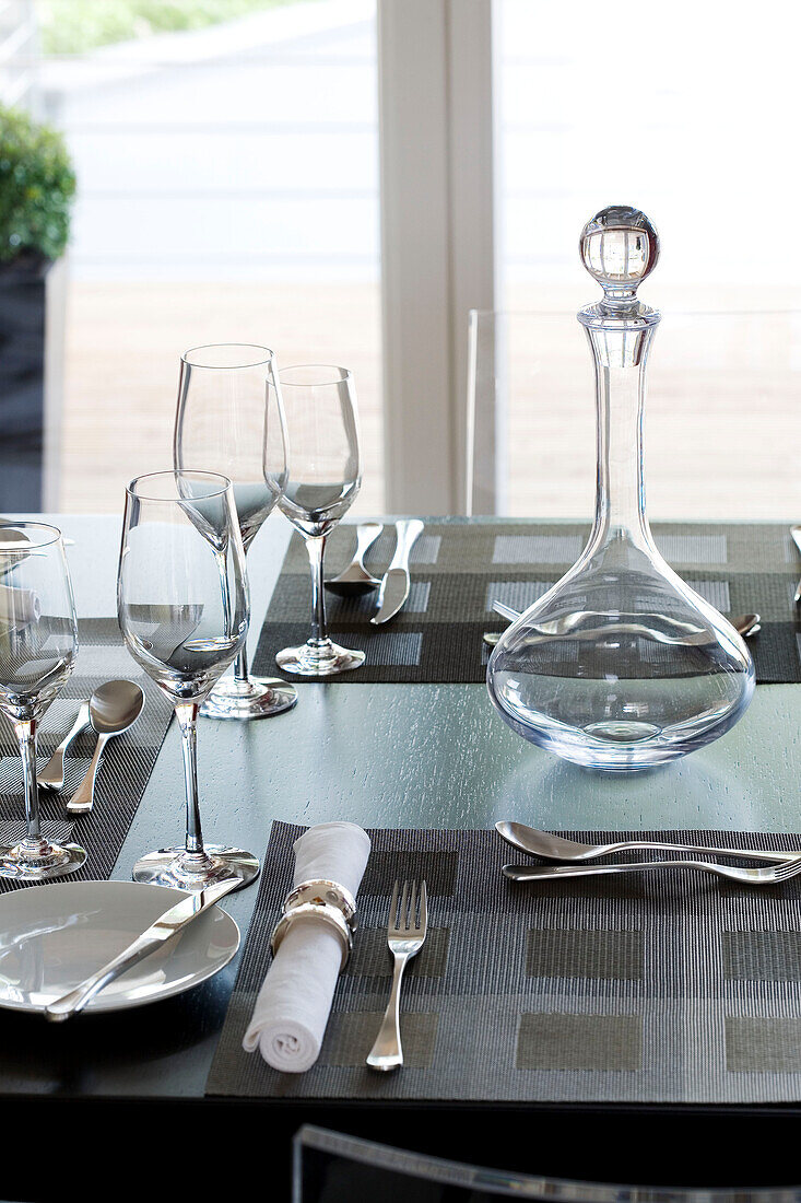 Place setting with decanter and wine glasses in Newmarket home Suffolk UK