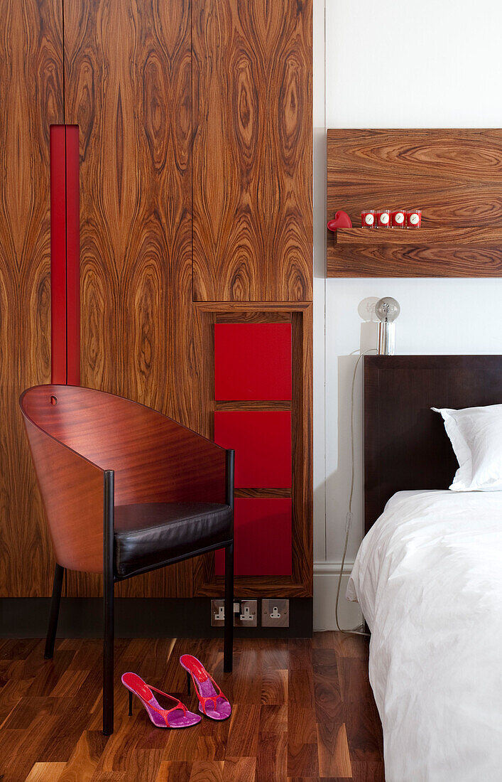 Wooden wardrobe and chair in Sussex bedroom UK